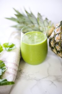 green smoothie with pineapple and basil (close up)