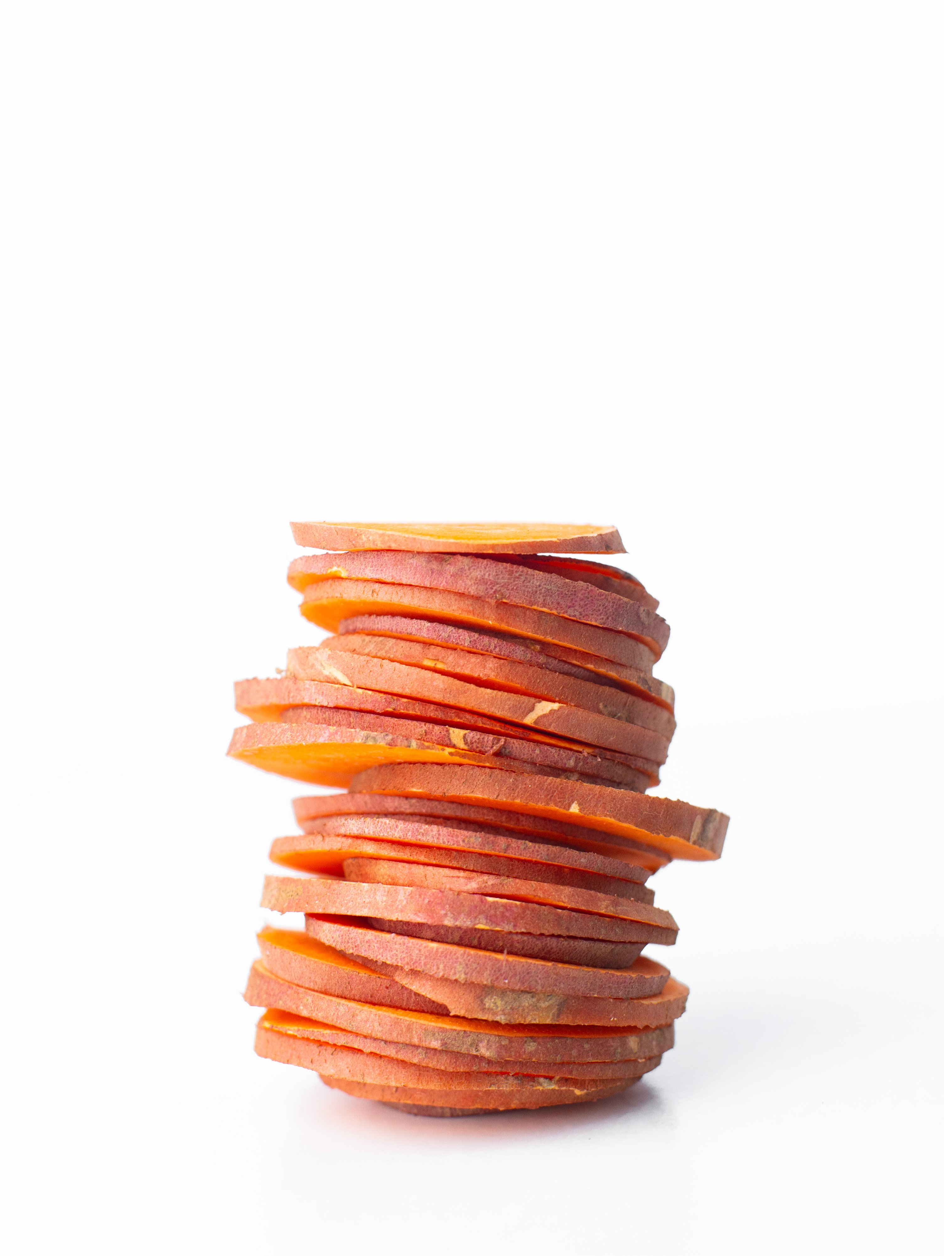 stack of thinly sliced sweet potatoes